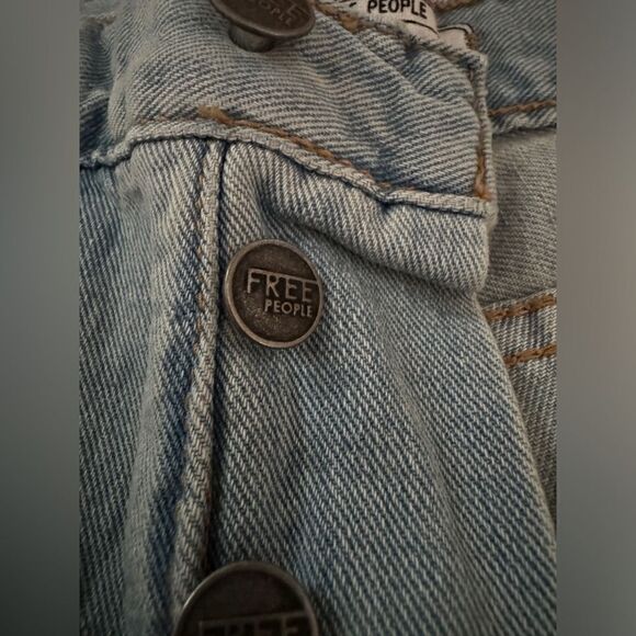 Free People distressed medium wash denim button fly cuffed shorts. 25 - Picture 6 of 12